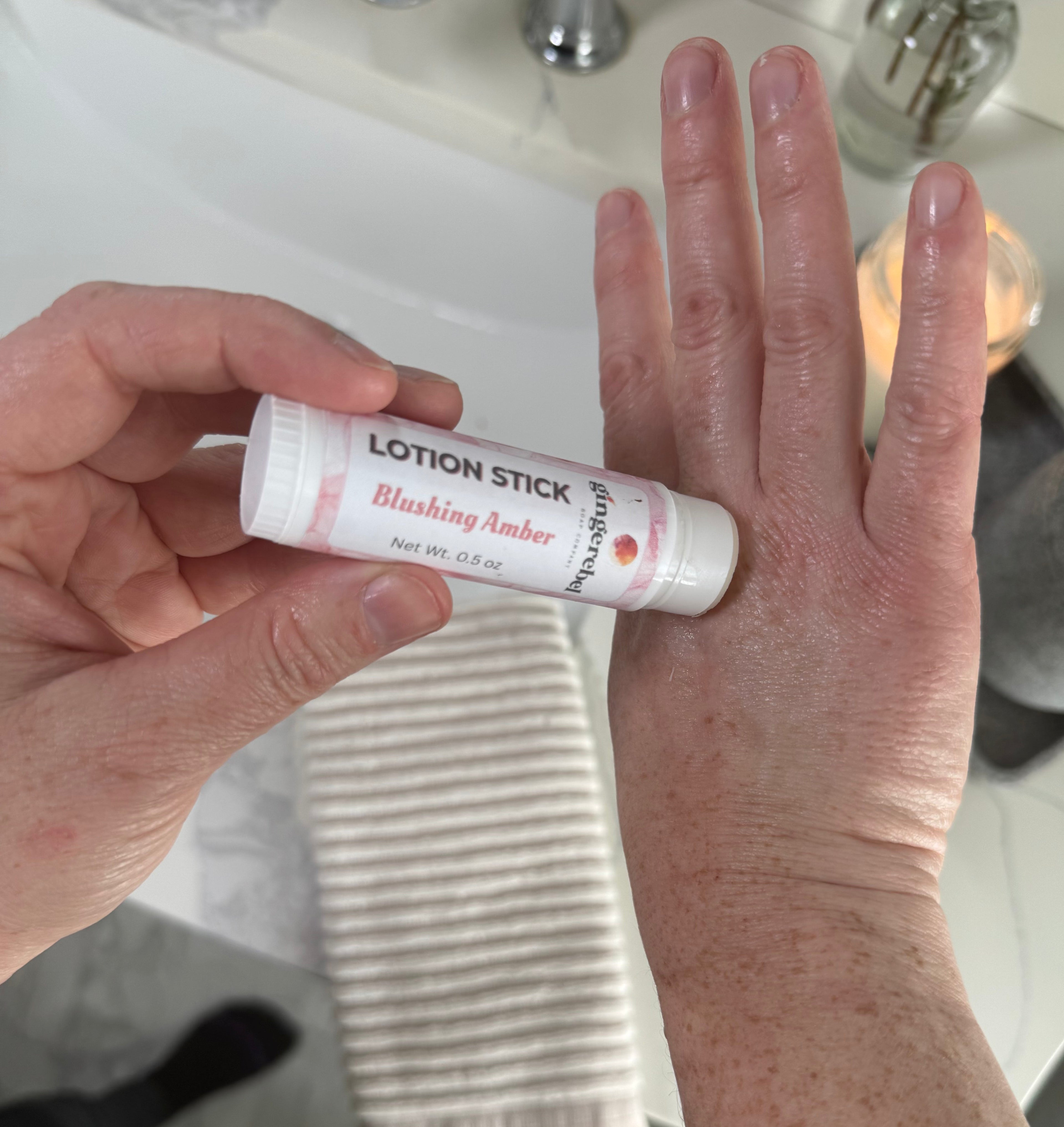 Lotion Stick being rubbed on a hand