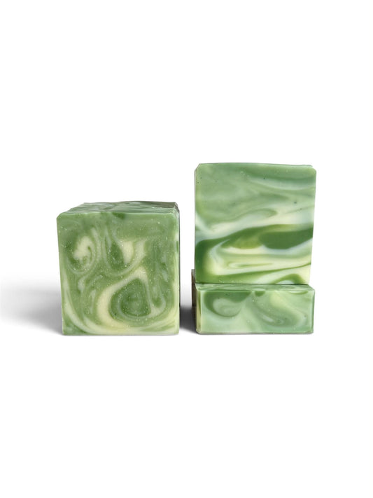 Three rectangular bars of handmade soap with a green and white marbled swirl pattern, displayed on a clean white background.