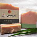 3 peach soaps on the sand