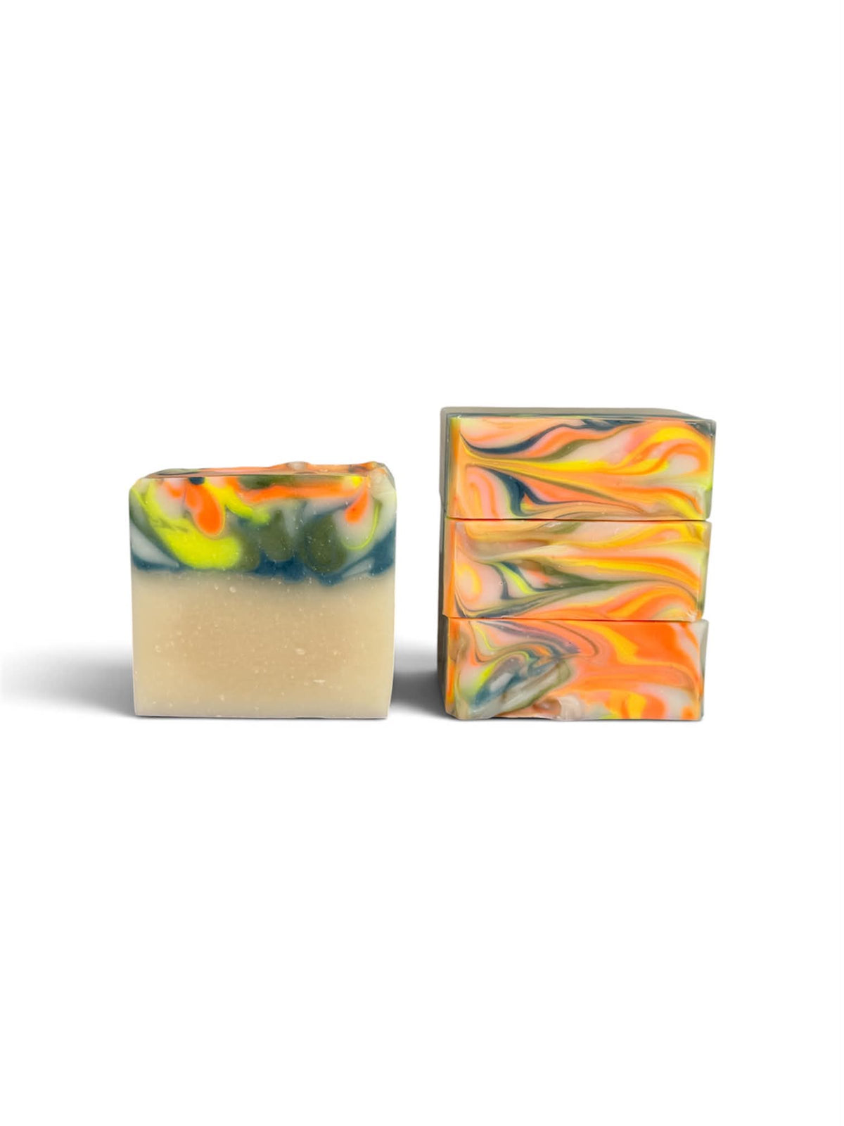 Two rectangular bars of handmade soap with marbled swirls of orange, yellow, green, and blue on a light beige base, displayed on a clean white background.