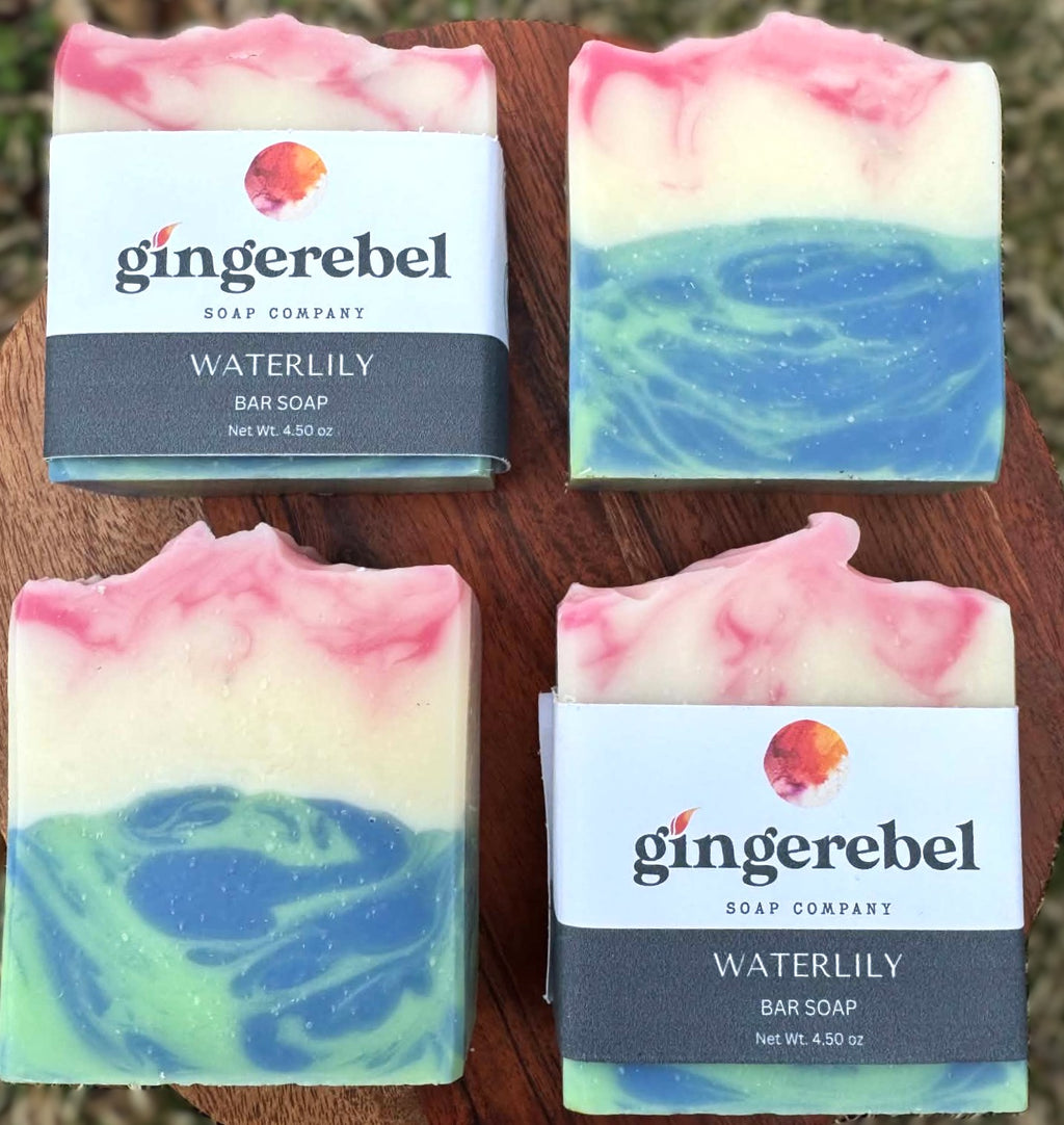 Gingerebel Waterlily bar soaps on a wooden surface