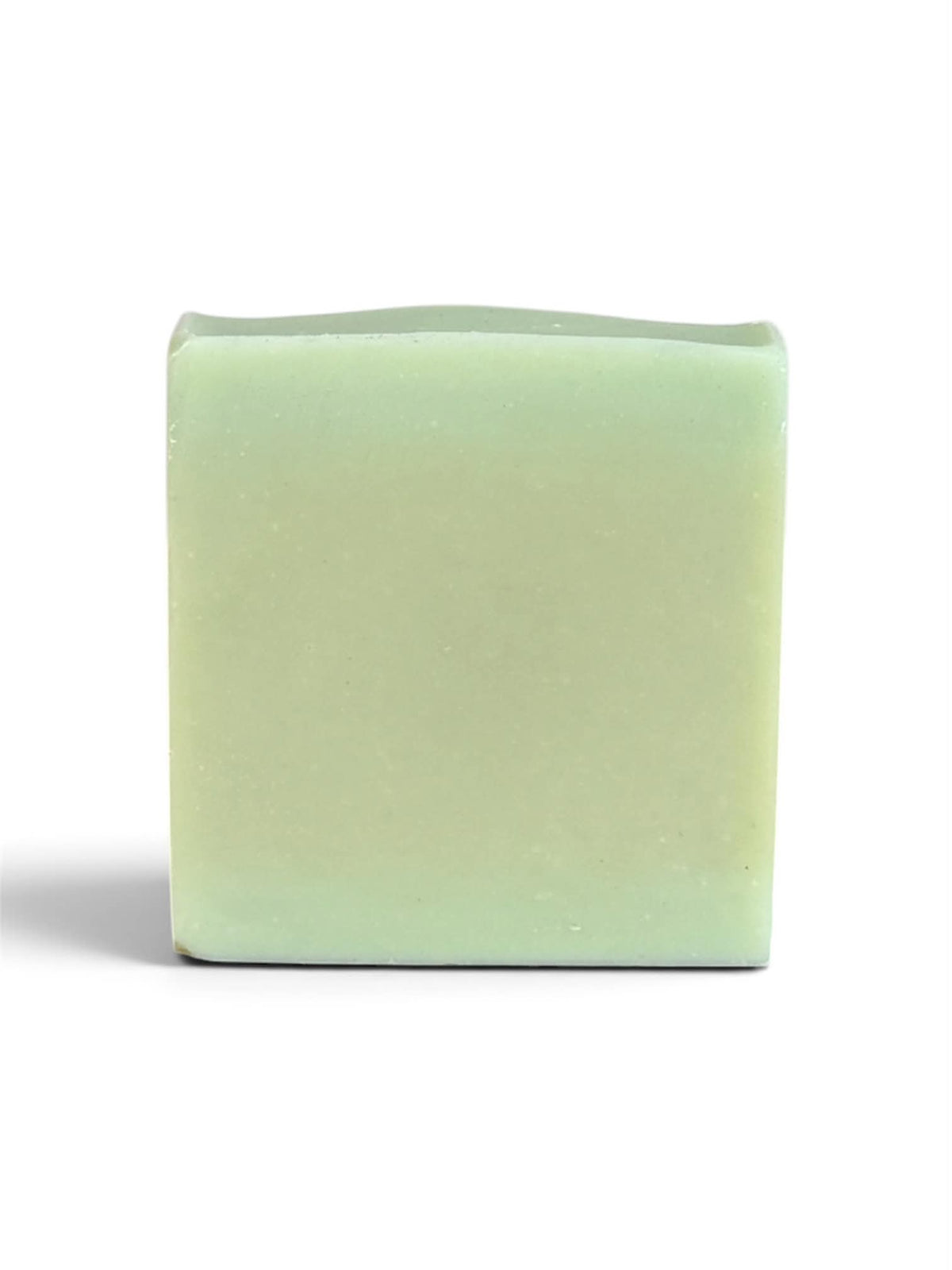 A single rectangular bar of pale mint green soap standing upright on a white background.