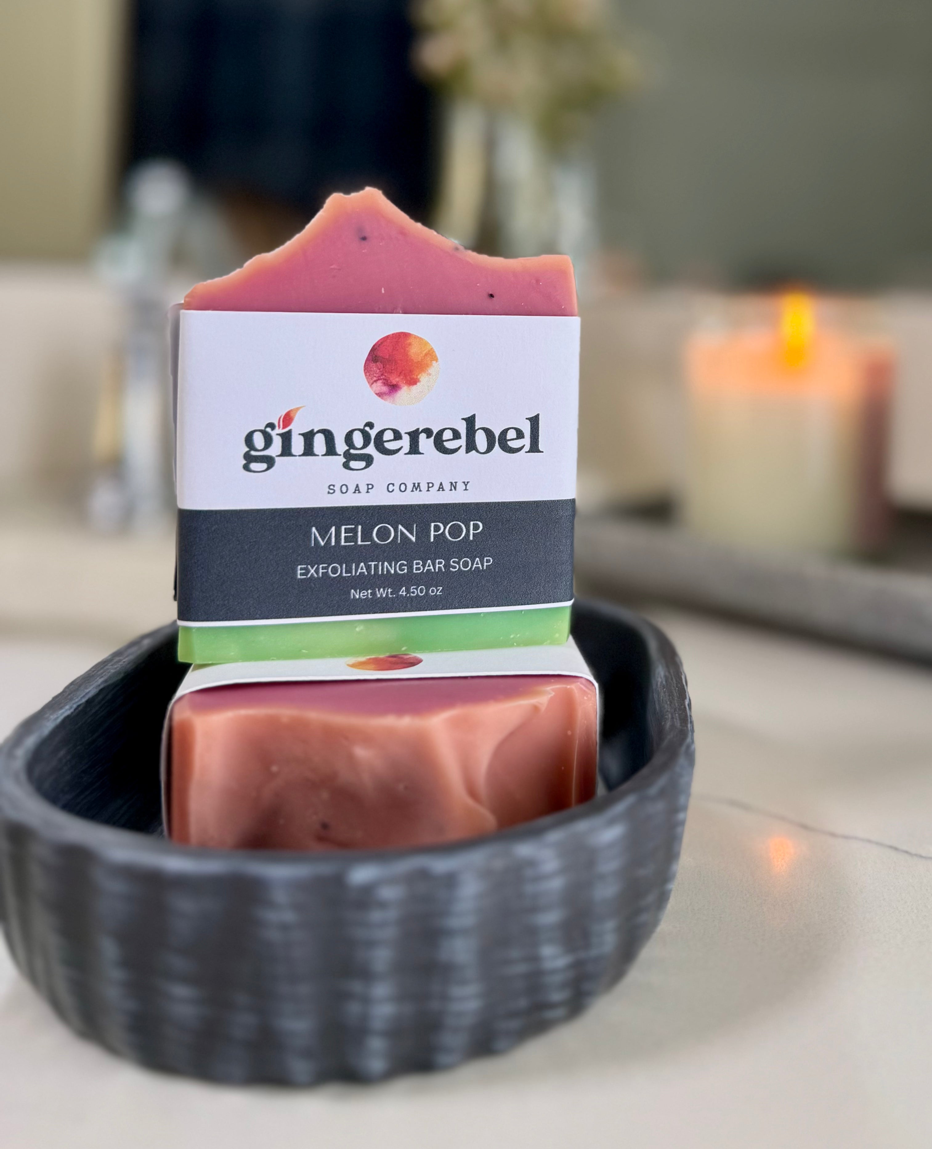 Gingerebel soap bar in a black bowl with a blurred background