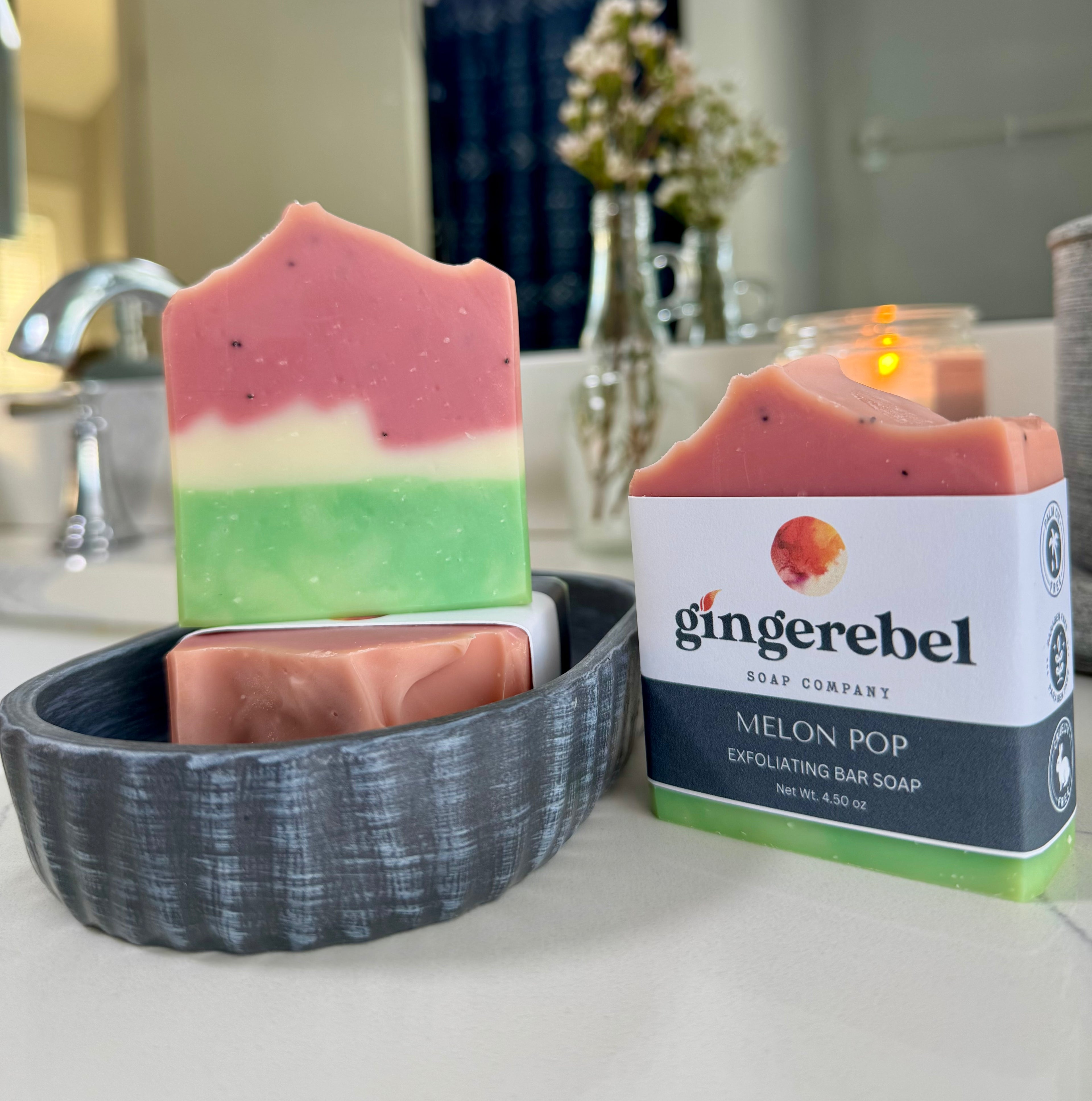 Gingerebel Soap Company Melon Pop soap bar with packaging on a bathroom counter.