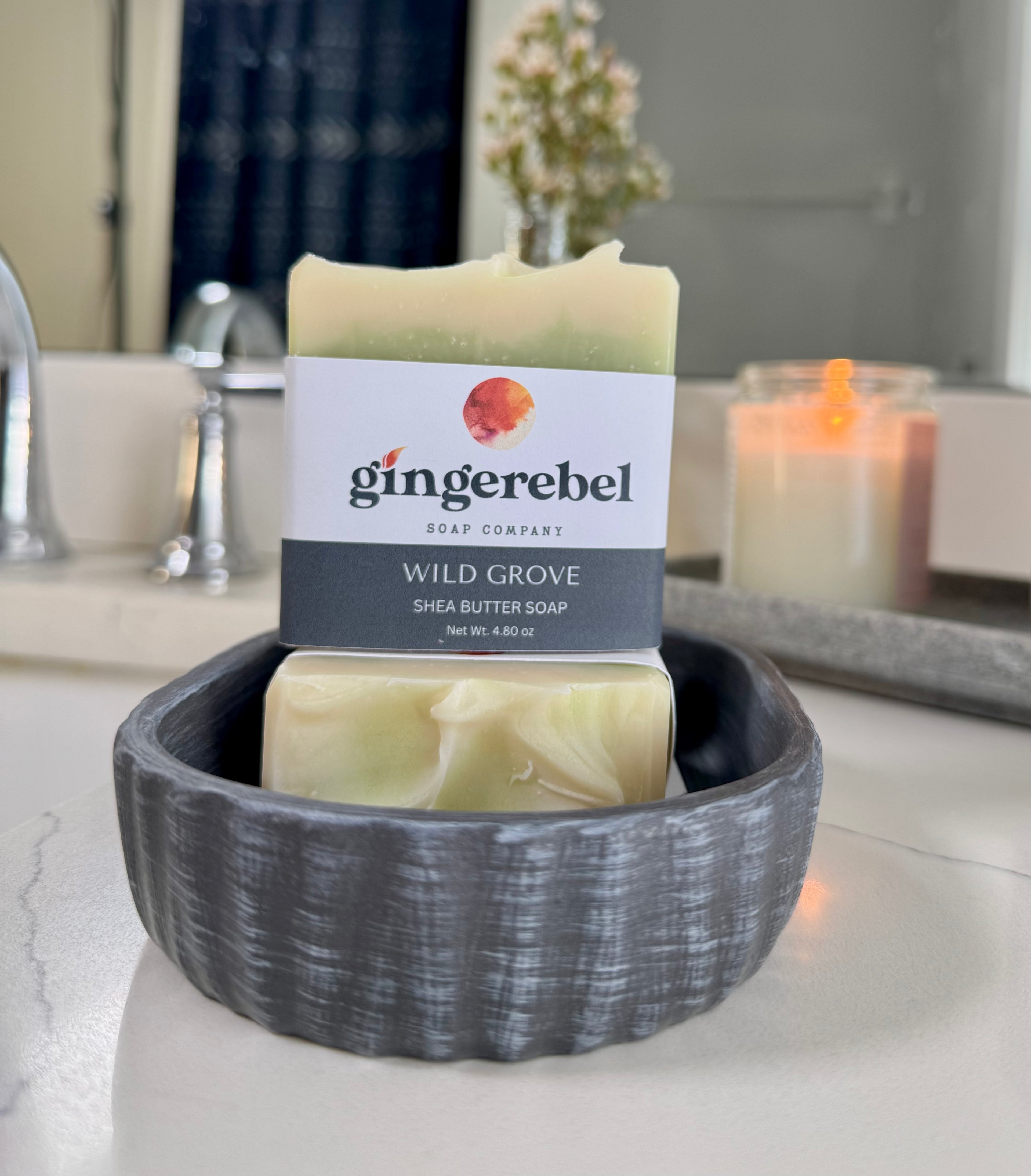 Bar soap with gingerebel branding on a bathroom countertop