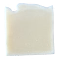 White bar of soap on a white background