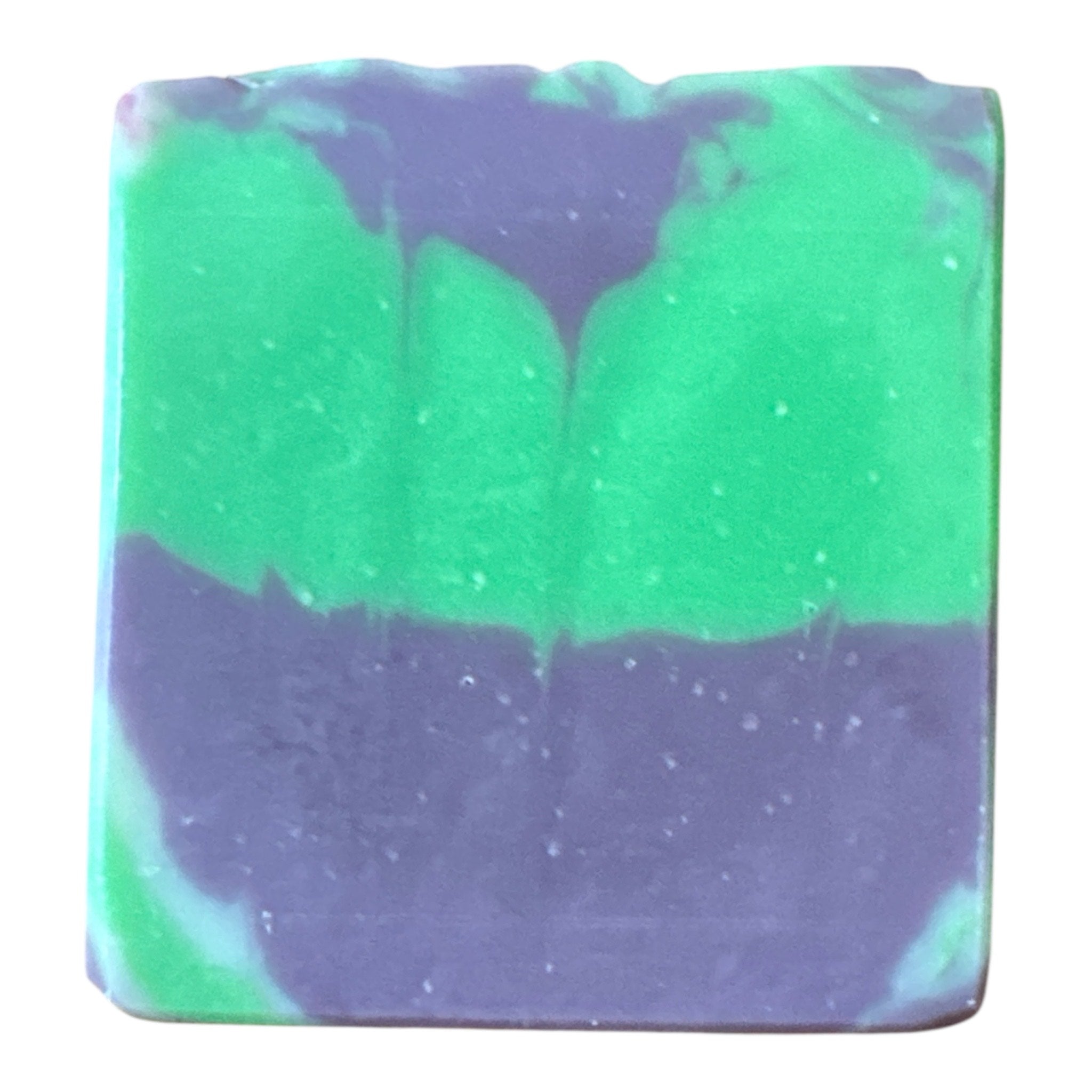Bar of soap with green and purple swirled pattern on a white background