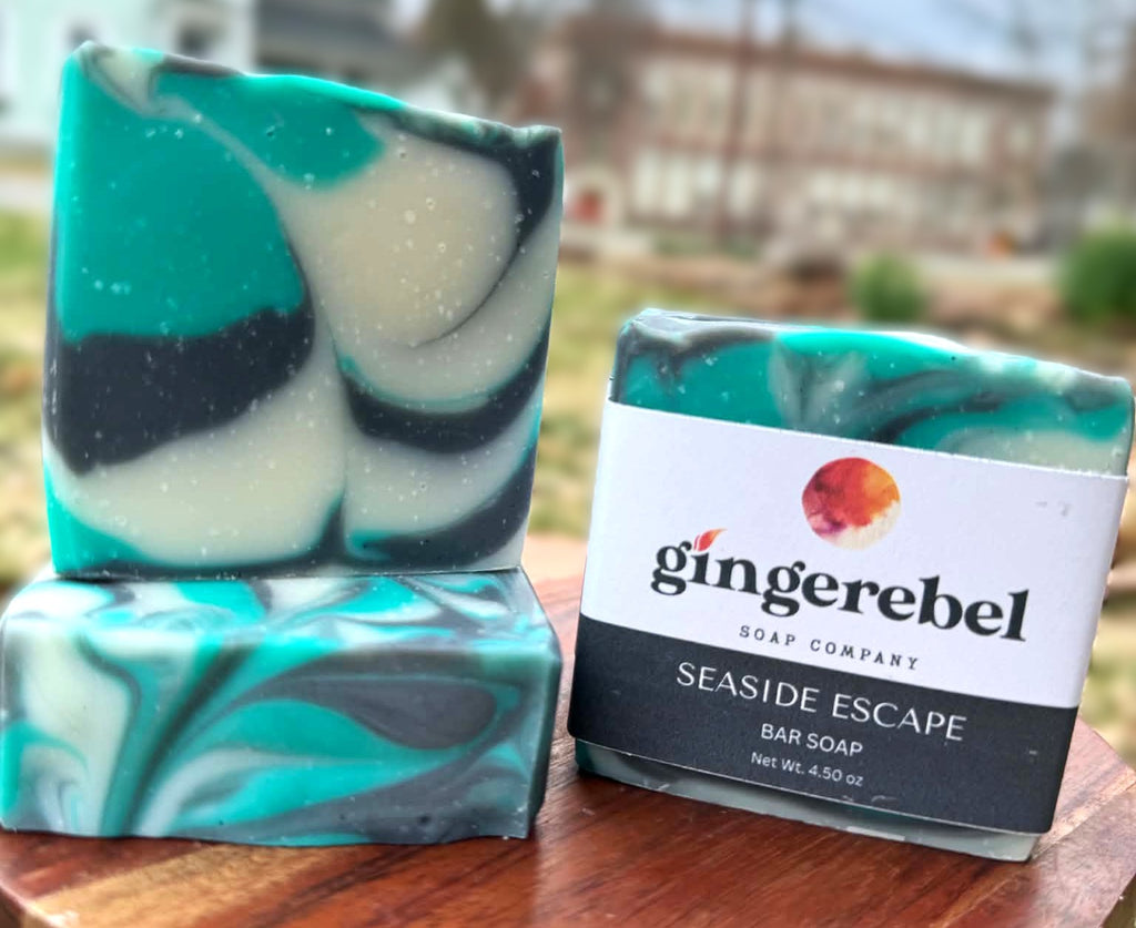 Gingerebel Seaside Escape soap bar with marbled design on a wooden surface