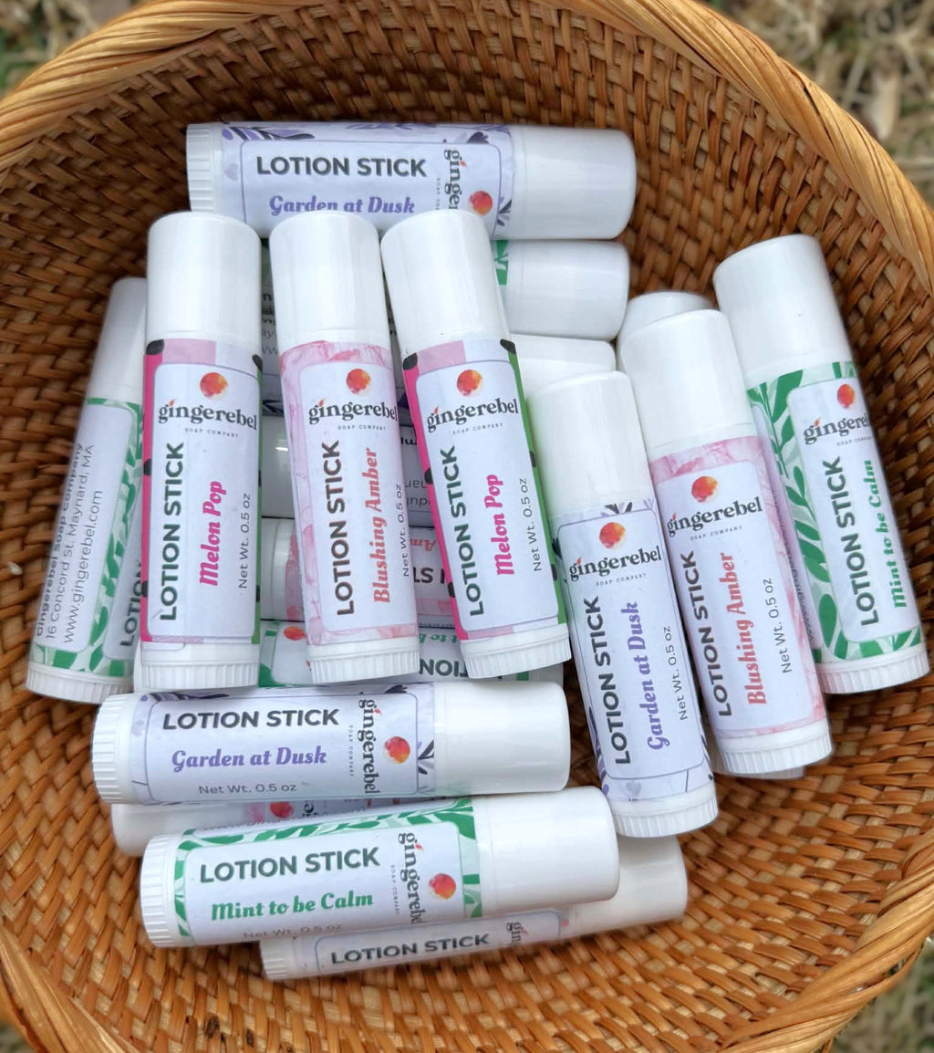 Assorted lotion sticks in a wicker basket