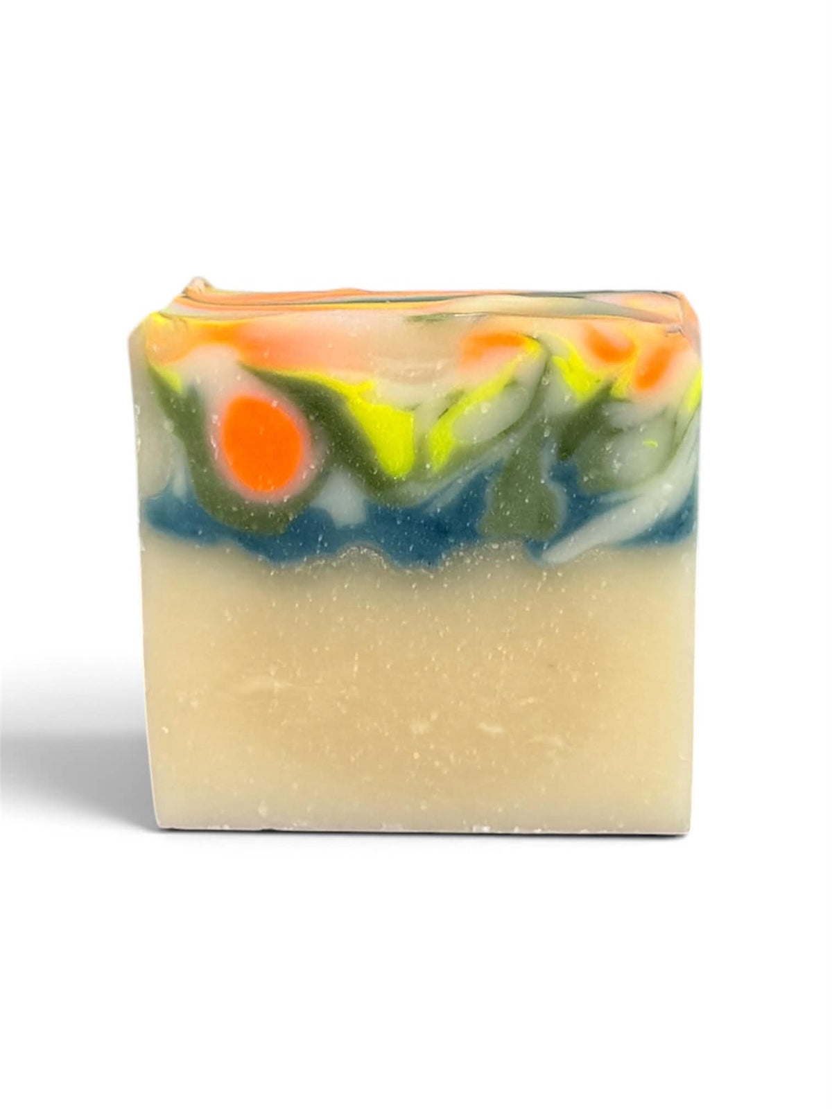 A rectangular handmade soap bar with a speckled cream-colored base and a colorful marbled top layer featuring orange, yellow, green, and blue swirls, set against a plain white background.